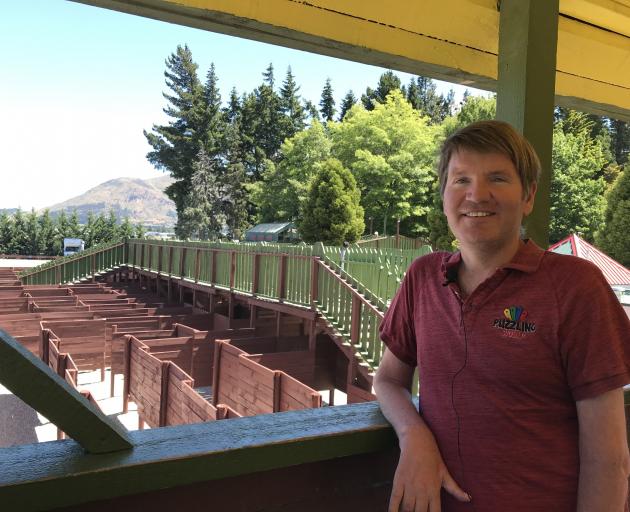 Puzzling world marketing and operations manager Duncan Spear stands above the Wānaka Maze, the...