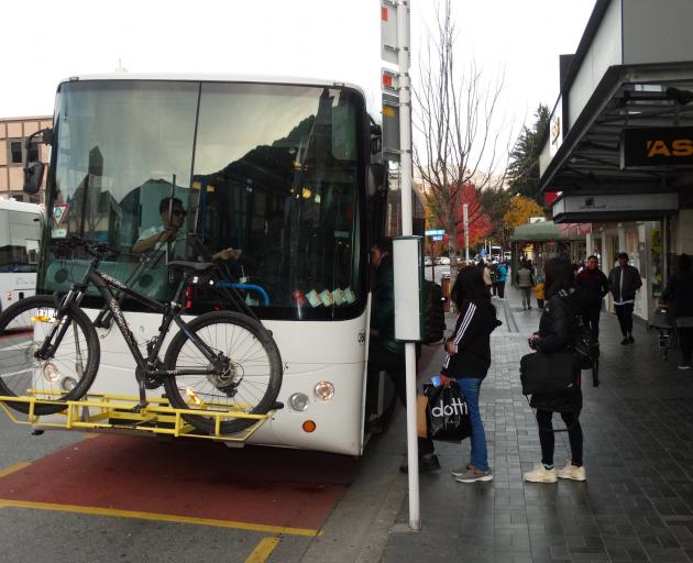 Passengers board a bus in Camp St, Queenstown. PHOTO: GUY WILLIAMS
