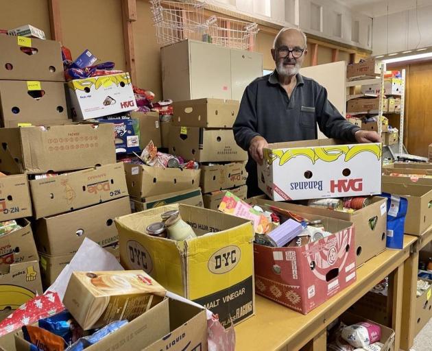 Oamaru Combined Churches Food Bank manager, Bernard Wilkinson with another box of food donations...