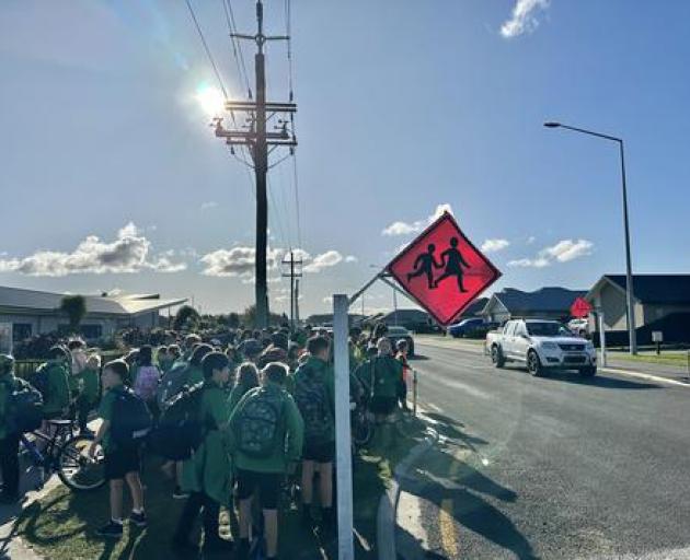 West Rolleston Primary School pupils wait to cross Dunns Crossing Rd. Photo: supplied