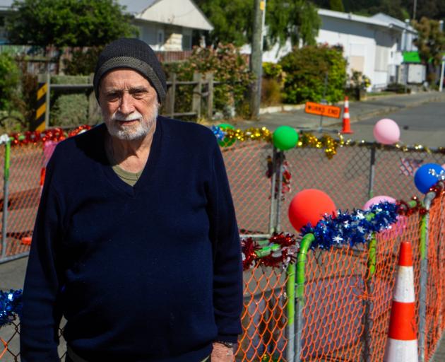 Beal St resident John Sim stands beside the festive redesign his neighbours gave the long-term...