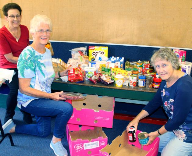 Preparing to help struggling families have a little bit extra at Christmas are (from left)...