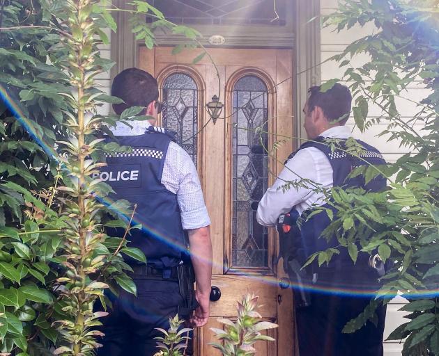 Police arrive at the Auckland home of former MP Golriz Ghahraman yesterday. PHOTO: THE NEW...