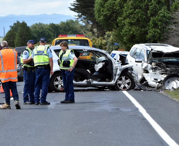 Emergency services at the crash scene on Friday. Photo: Peter McIntosh