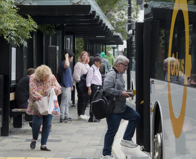  Passengers board a bus at Dunedin’s bus hub in Great King St yesterday afternoon. PHOTO: GERARD...