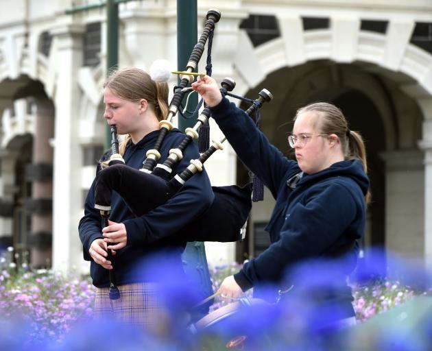 Sisters Anika, 15, (left) and Emily Franklyn, 16, both of Dunedin, busk outside the Dunedin...