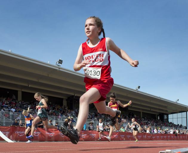 Brooklyn Landreth (South Otago) strides across the finish line during the grade 10 girls 100m race.