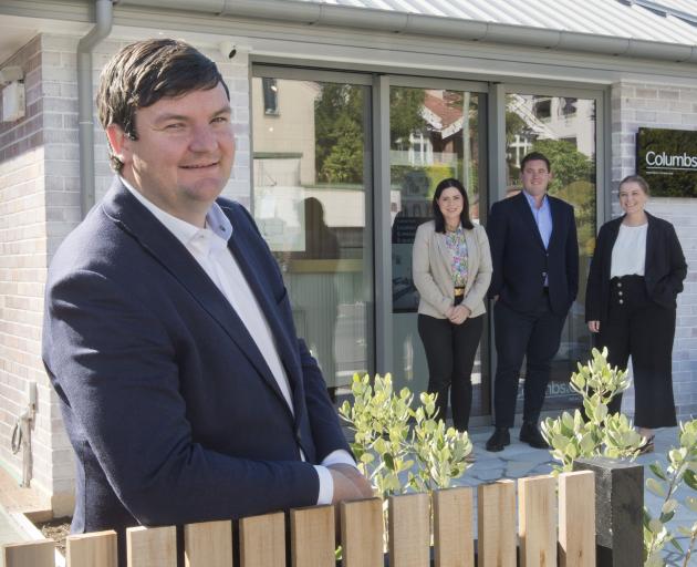 James Columb (front) and the team at Dunedin real estate agency Columbs and Co (from left) Amy...