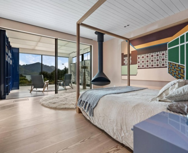 The master bedroom looks out to a stunning landscape. The design philosophy was to create a ...