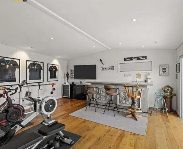 The former All Blacks coach built a bar and gym in his seaside home three years ago. Photo: Supplied