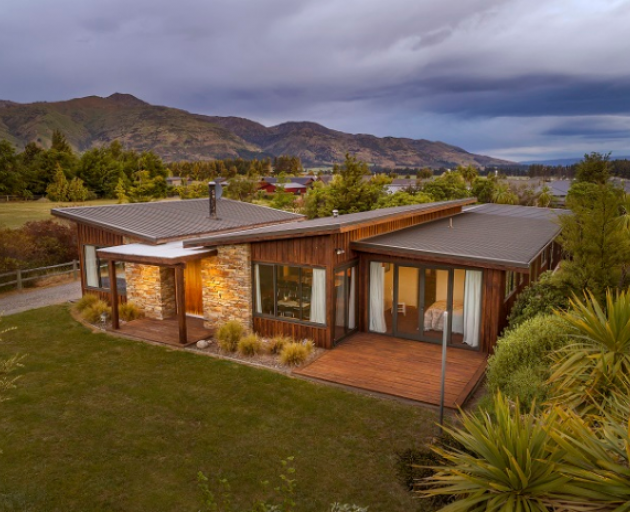 A 10-year-old house on Nichol Street, Lake Hāwea, is one of the new alpine-style architecture...
