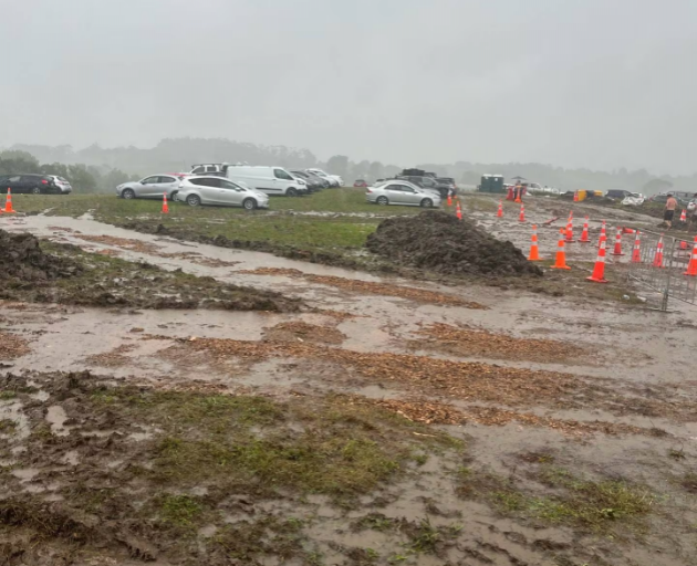 Mud covers the campsite and carpark at the Northern Bass music festival in Northland.