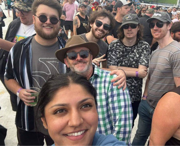Foo Fighters fan David Pasco, (in the middle, wearing the green and blue shirt) attending the...