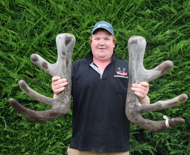 Brock Deer owner Elliot Brock displays the velvet head of 752BL20, a stag which sold for $100,000...
