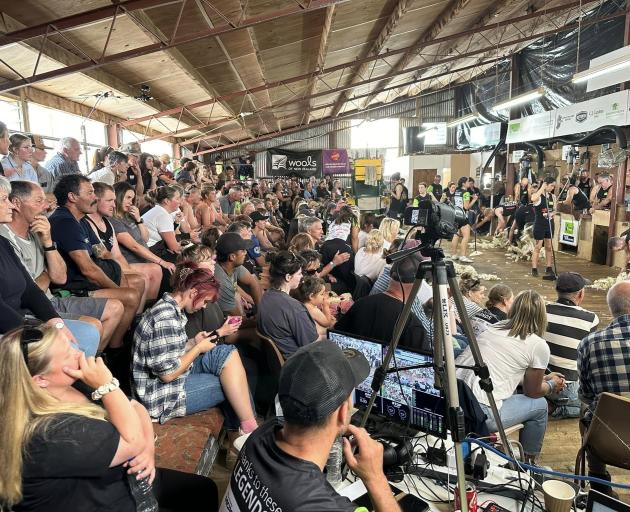 A crowd watches a five-stand shearing record in the Grant brothers’ woolshed in the Hokonui Hills...