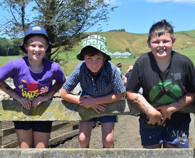 Indi Kirk, 10, of Waimumu, Seth Lawlor, 8, of Waikaka Valley, and Axel Kirk, 10, enjoy the final...