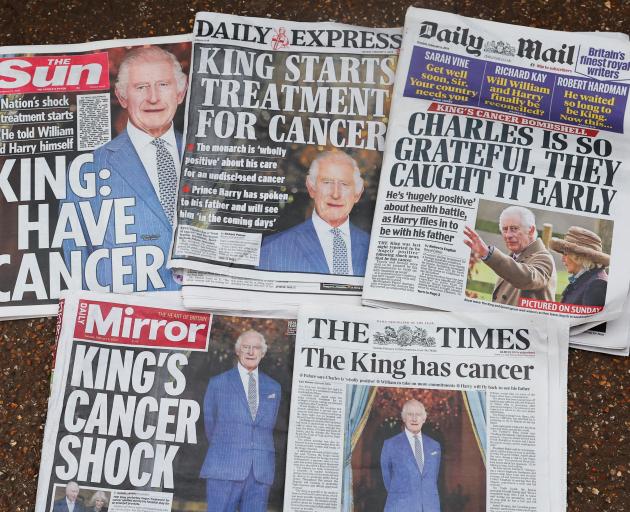 British newspapers reporting Britain's King Charles' cancer diagnosis are displayed, after the...