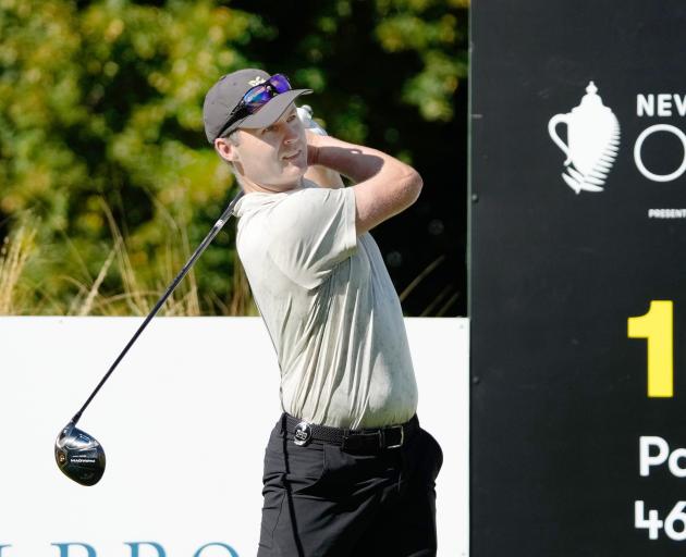 Day one co-leader Matthew Griffin, of Australia, watches the flight of the ball after driving...