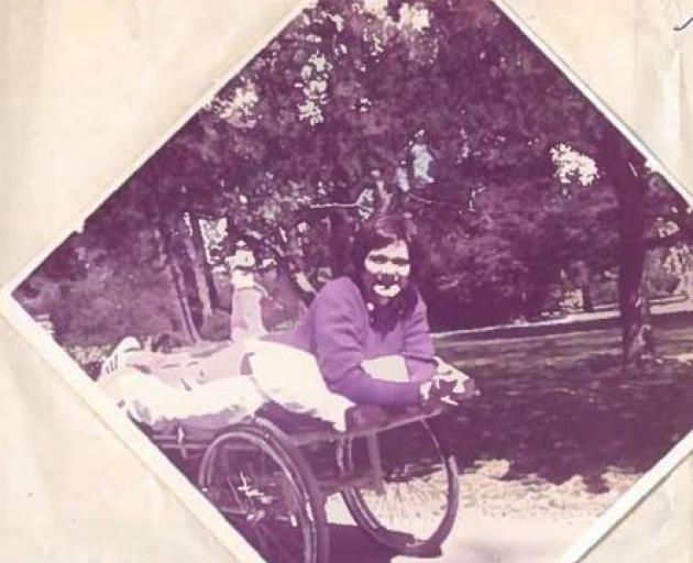 Dominique Vallette being wheeled into the Botanical Gardens during her recovery. Photo: Supplied