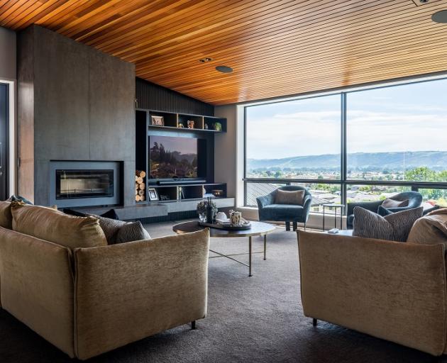 The living area’s timber ceiling has a sound barrier behind it to reduce any echoes.