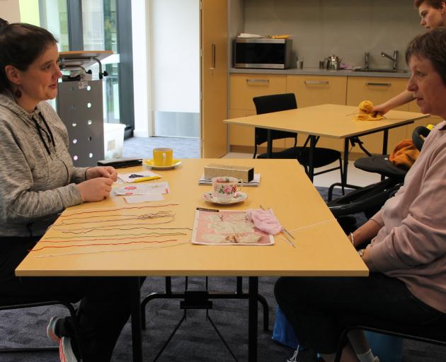 Gore Library staff member Megan Tredwell (left)  and Lynda Irving, of Gore, have a chat about...