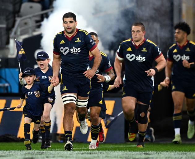 Billy Harmon leads the Highlanders onto the field against the Chiefs at Forsyth Barr Stadium...