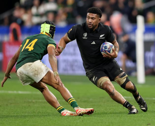 All Black Ardie Savea looks for a way around South Africa’s Kurt-Lee Arendse during the 2023...