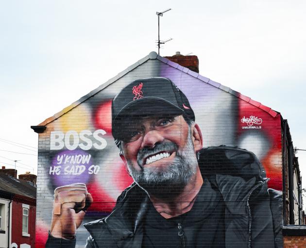 A mural of Klopp on the side of a house near Anfield.