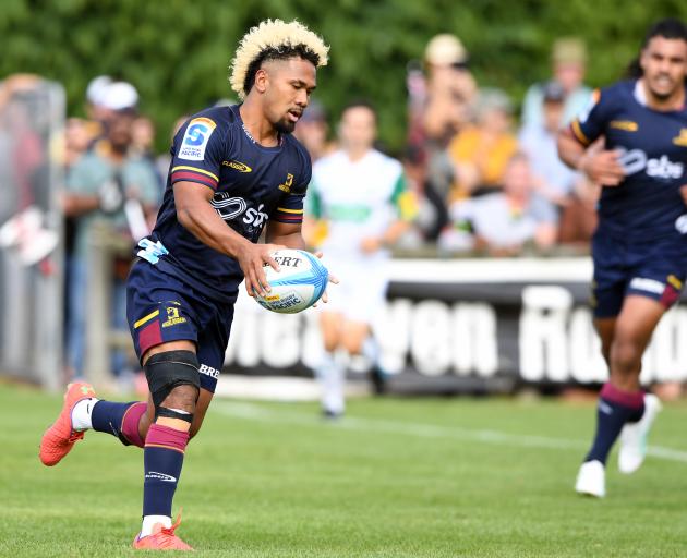 Folau Fakatava runs to score a try during the Super Rugby Pacific preseason match between the...