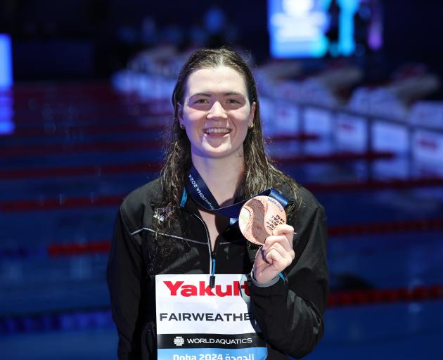 Erika Fairweather celebrates adding a bronze in the 800m freestyle to her world championships...