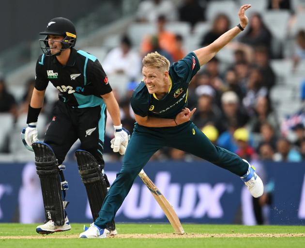 Nathan Ellis of Australia bowls during the final match of the T20 series between New Zealand and...