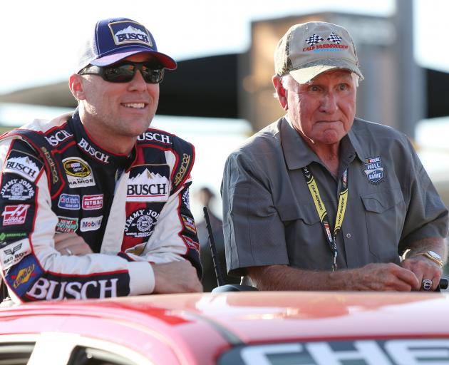 Kevin Harvick, driver of the #4 Busch Chevrolet, rides with NASCAR Hall of Famer Cale Yarborough...