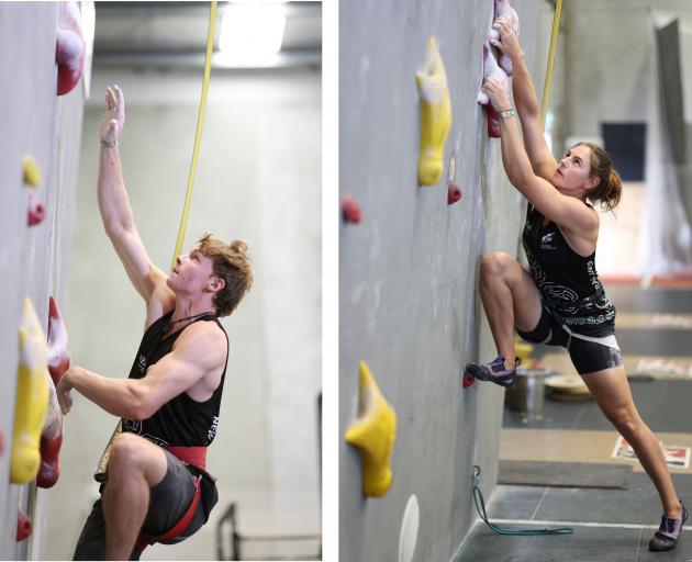 Julian David and Sarah Tetzlaff negotiate a climbing wall during the announcement in Mount...