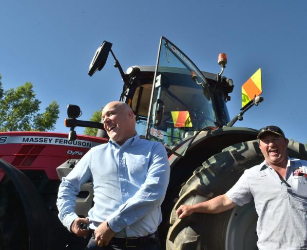 Prime Minister Christopher Luxon (left) has a laugh with Dillon Harvesting owner Mark Dillon, of...