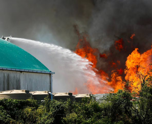 Fire crews battle the massive blaze. Photo / Dean Purcell