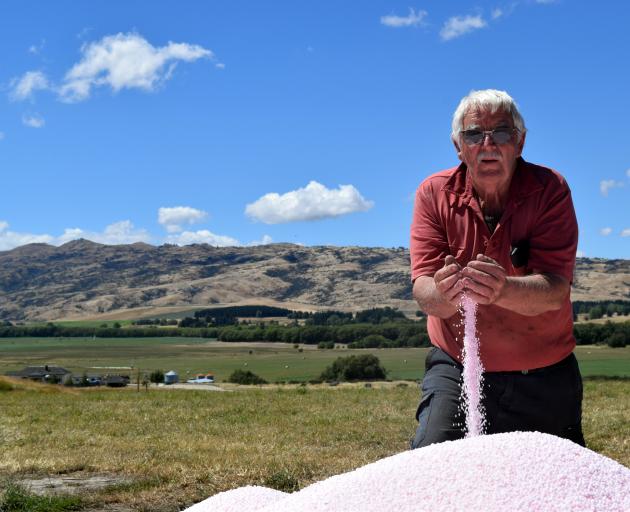 Sheep and beef farmer James Armstrong inspects the urea set to be spread by air on his winter crops.