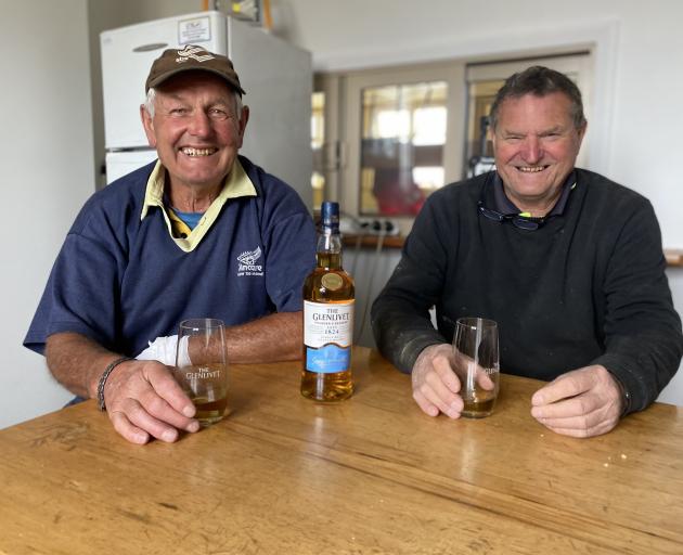 Retired farmer Gordon Wilson (left) and semi-retired builder Geoff McHardy enjoy knock-off time...