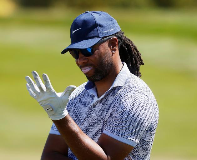 Former NFL star Larry Fitzgerald pauses between shots during the New Zealand Open at Millbrook....