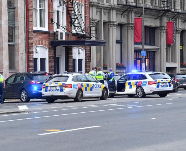 Police surround a car in Crawford St this morning. Photo: Stephen Jaquiery 