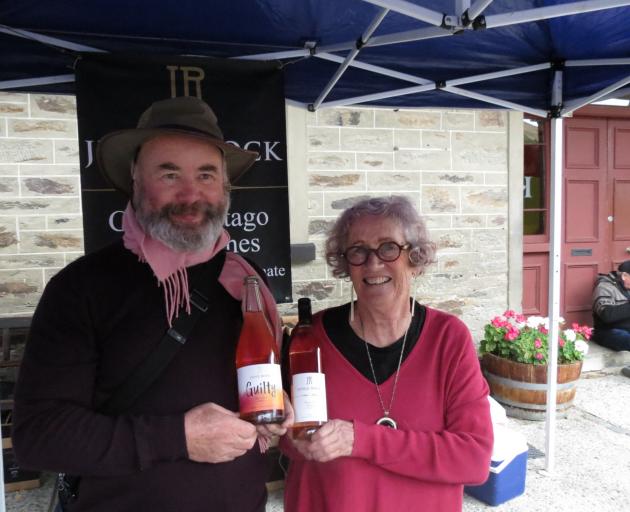Judge Rock owners Paul and Angela Jacobson show off their wares at the festival.