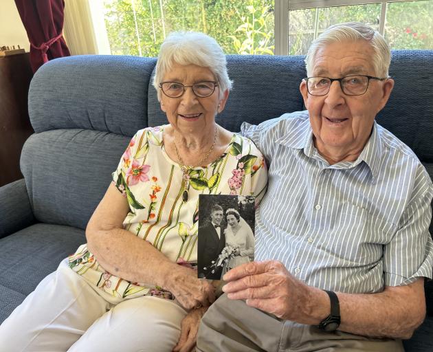 Dawn and Brian Becker with a photo taken at their wedding on March 21, 1959. They celebrated...