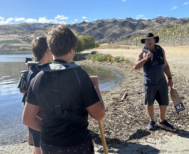 Aoraki Dragon Boat Association events director Mike Robinson (right) instructs Cromwell College...