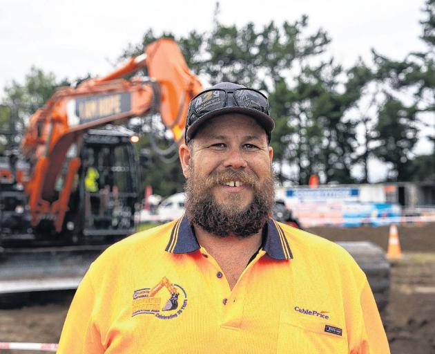 Digging it . . .Troy Calteaux won the national excavator operator competition for the fourth year...