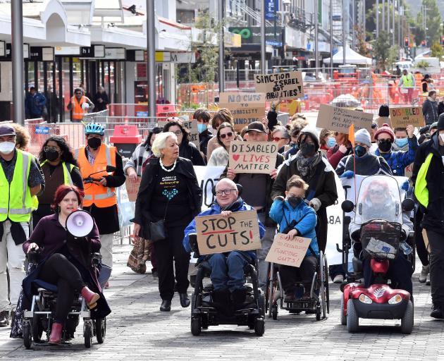 Members of Dunedin’s disabled community march down George St on Thursday. PHOTO: STEPHEN JAQUIERY
