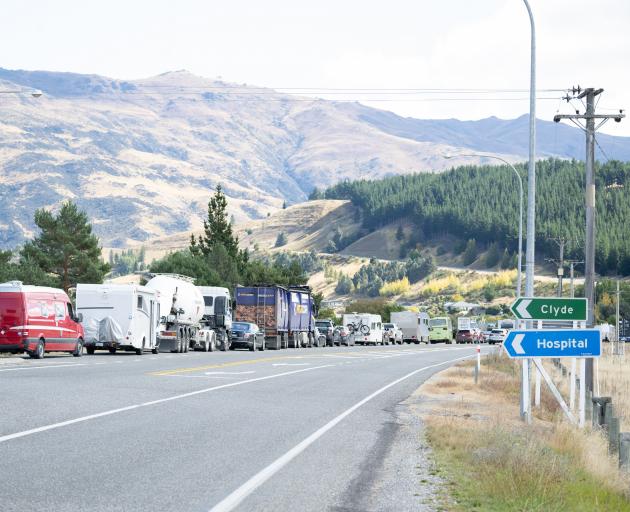 Vehicles backed up near Clyde await the reopening of State Highway 8 through the Cromwell Gorge.