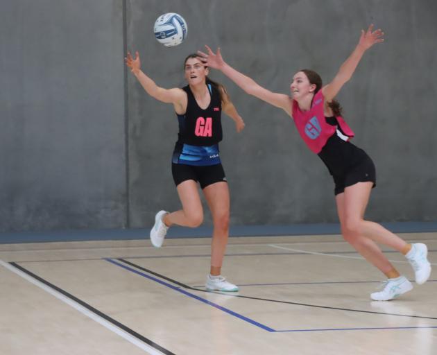 Southern Steel goal attack Georgia Heffernan (left) reaches for a pass during a game against the...