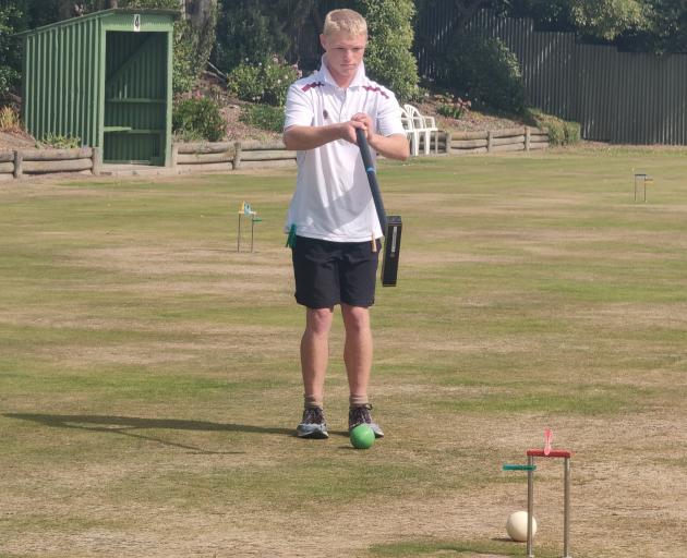 Gore Croquet Club player Max Philpott plays a shot during the Croquet New Zealand Don Reyland...