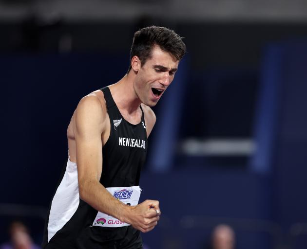 New Zealand's Hamish Kerr celebrates after winning the men's high jump during day three of the...