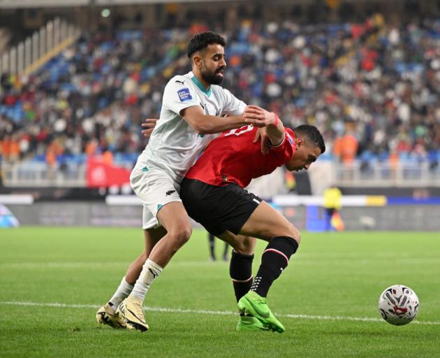 Egypt's Mostafa Mohamed Ahmed Abdalla is challenged by New Zealand's Sarpreet Singh. Photo: Getty...