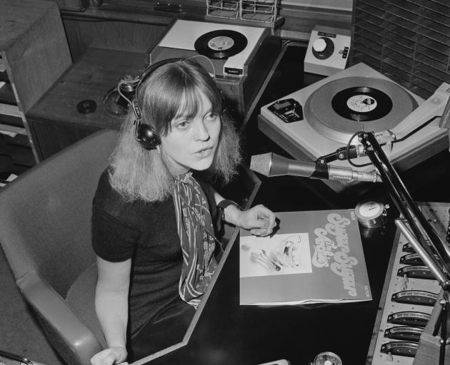 English Radio One disc jockey Annie Nightingale plays 'Sugar Sugar' by the Archies on her show on...